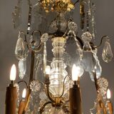 Golden bronze luster garnished with transparent and mordoréed pampilles