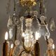 Golden bronze luster garnished with transparent and mordoréed pampilles