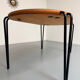 Solid wood dining table with tubular legs, 1980s postmodern design.