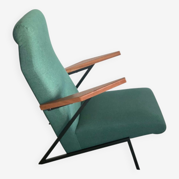 Lounge or easy chair with armrests