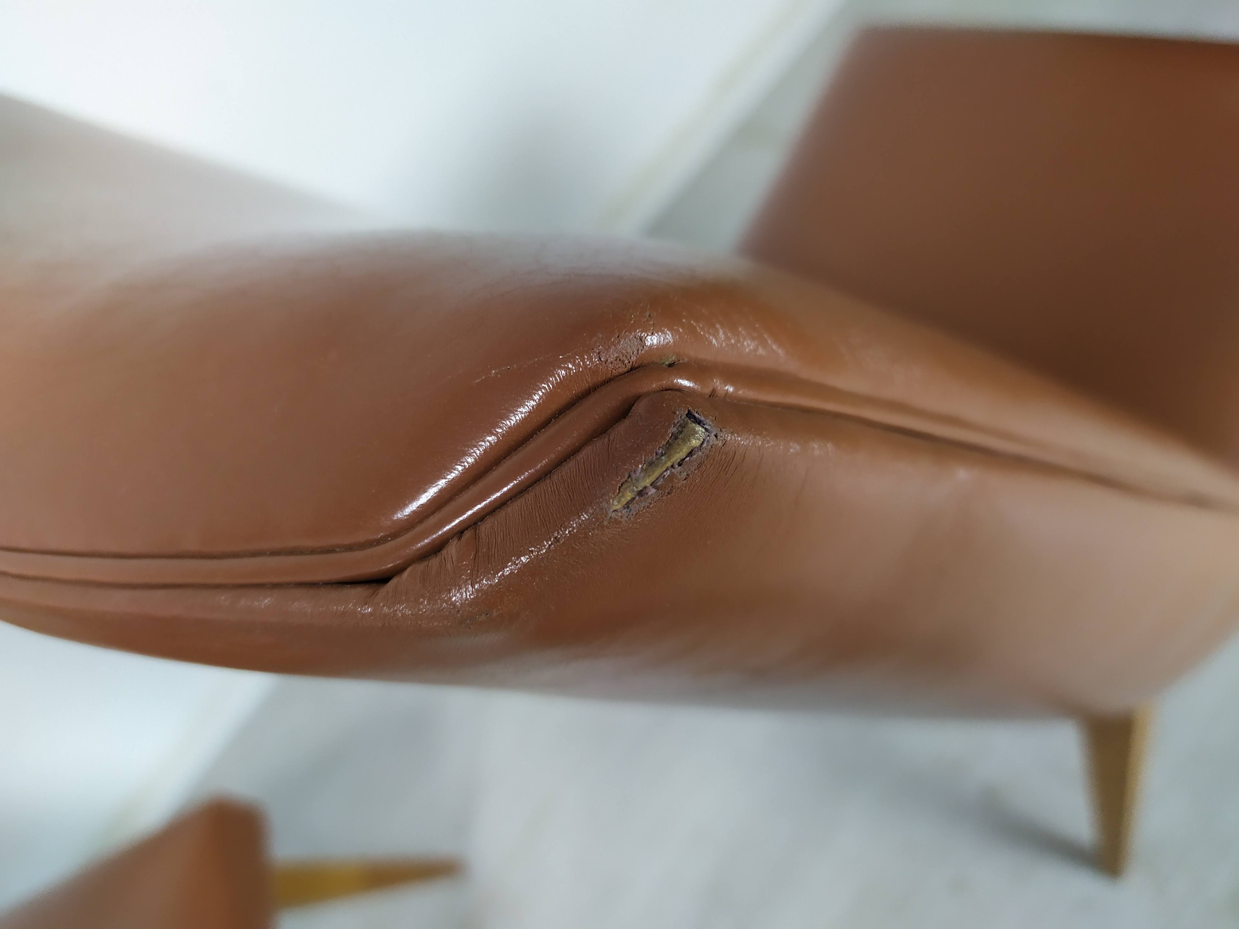 8 brown skai chairs 1950