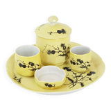 A yellow Art Deco ceramic tobacco service decorated with thistles from the 1920s to 1930s.