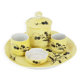 A yellow Art Deco ceramic tobacco service decorated with thistles from the 1920s to 1930s.
