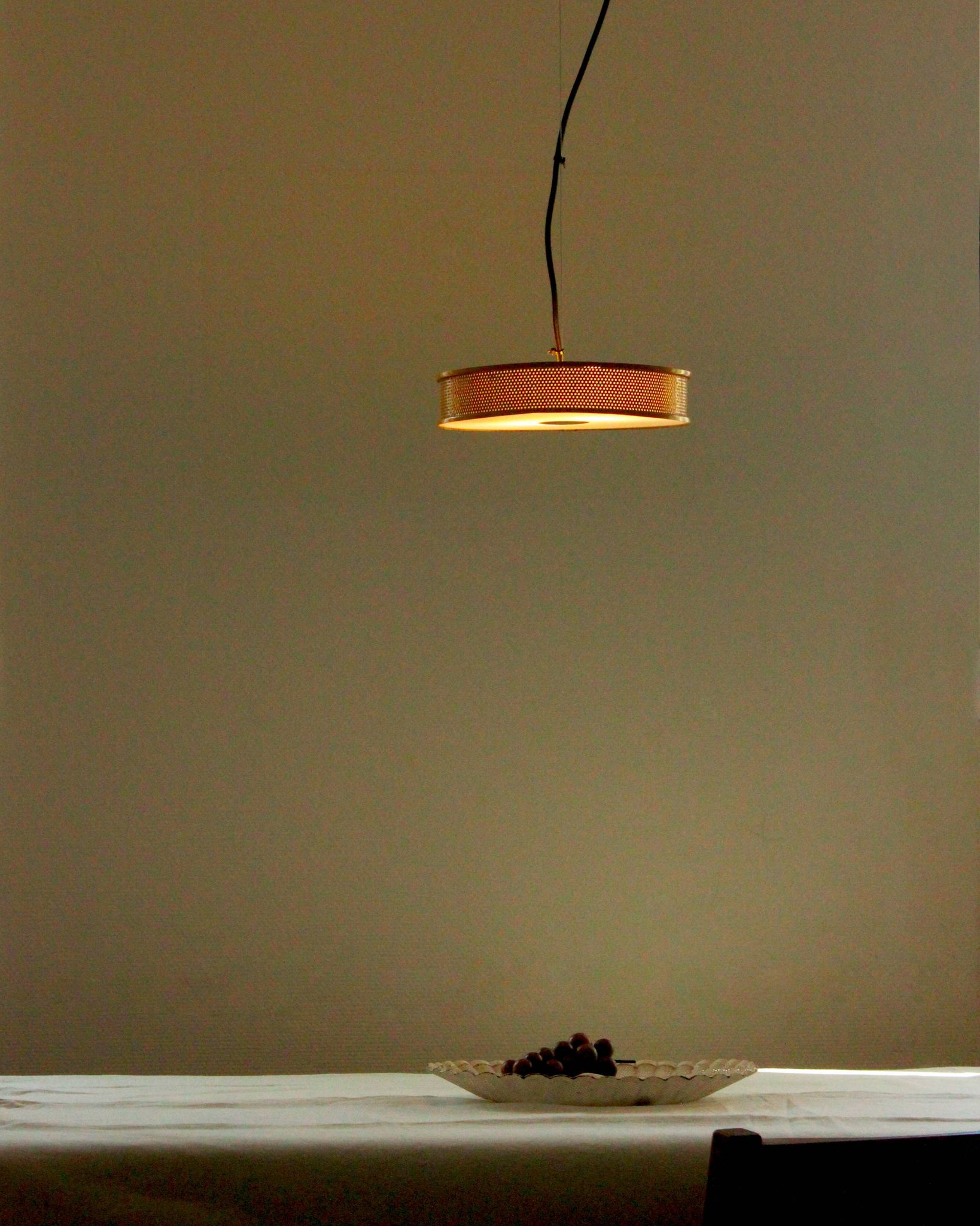 Yellow lacquered perforated metal pendant, in the style of Matégot or Biny.