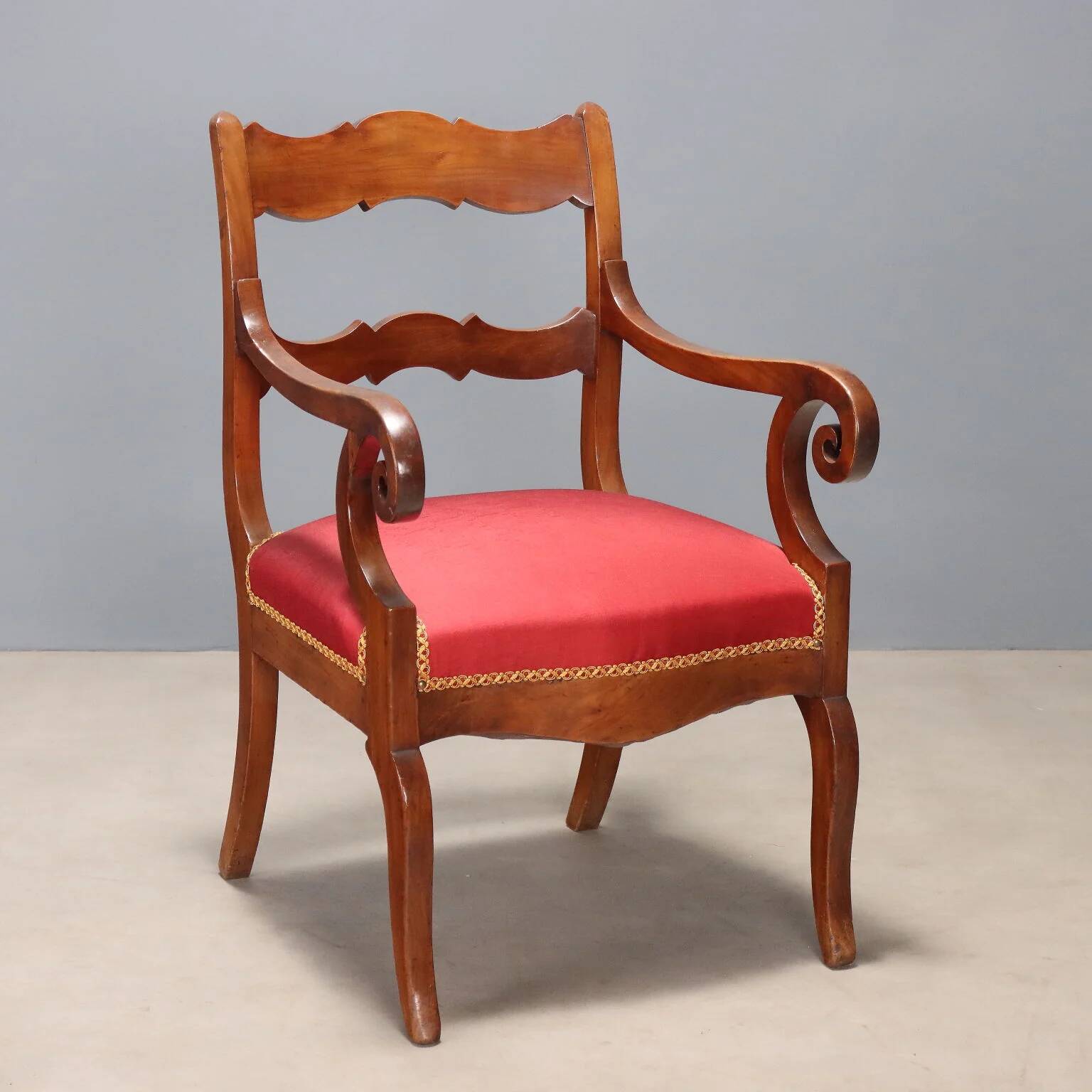 Antique Restoration-style armchair in walnut, fabric, Italy, 19th century.