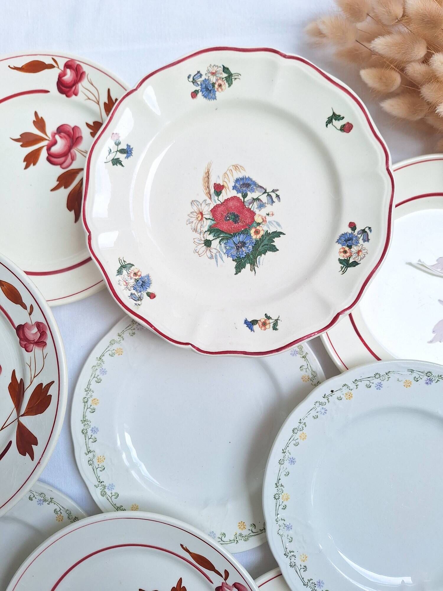 Vintage flower dessert plates from Sarreguemines, Longwy, and Lunéville.
