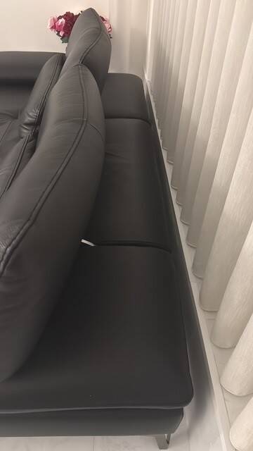 2 black leather sofas roche bobois scenario, one three-seater and one chaise longue.