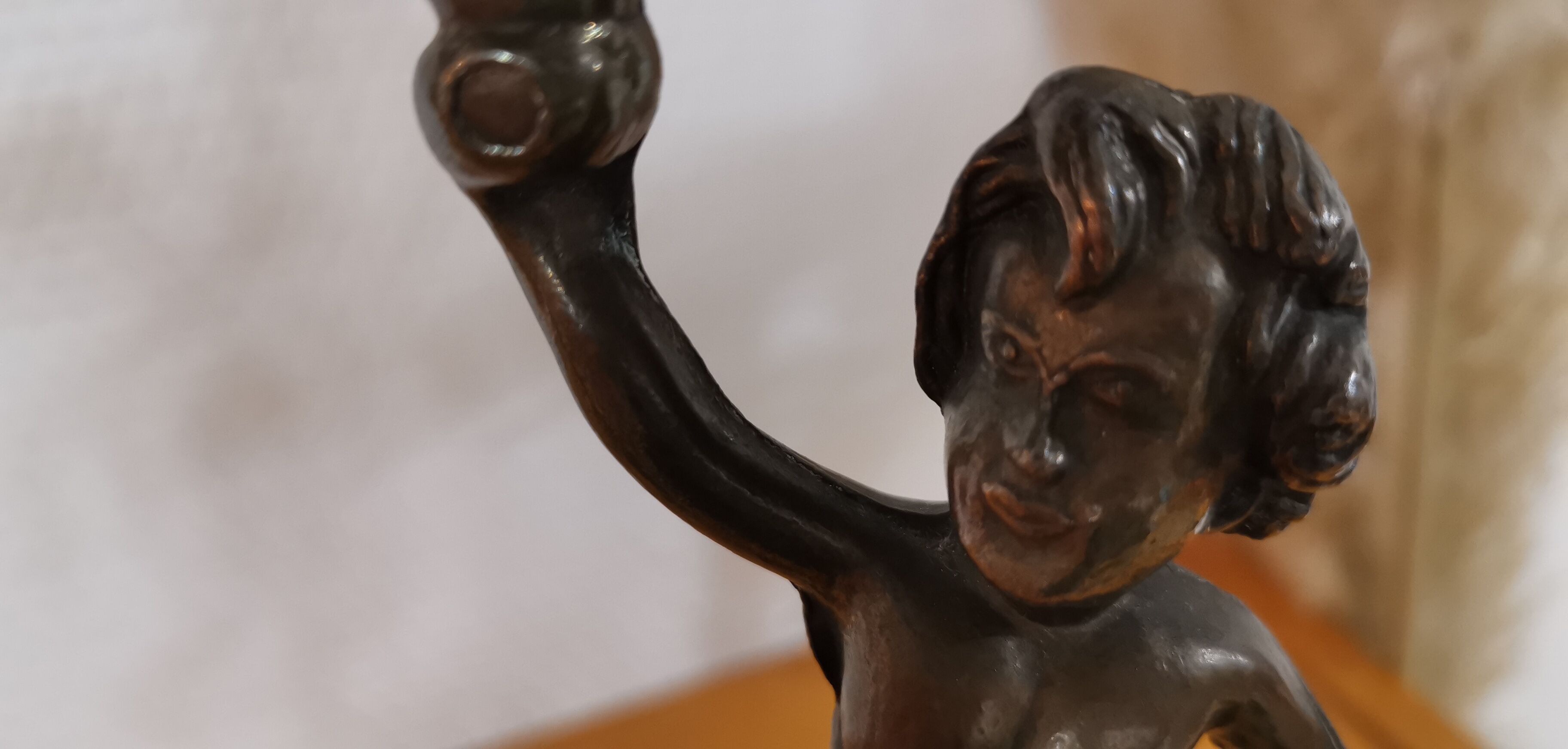 Pair of antique candlesticks in bronze and brass