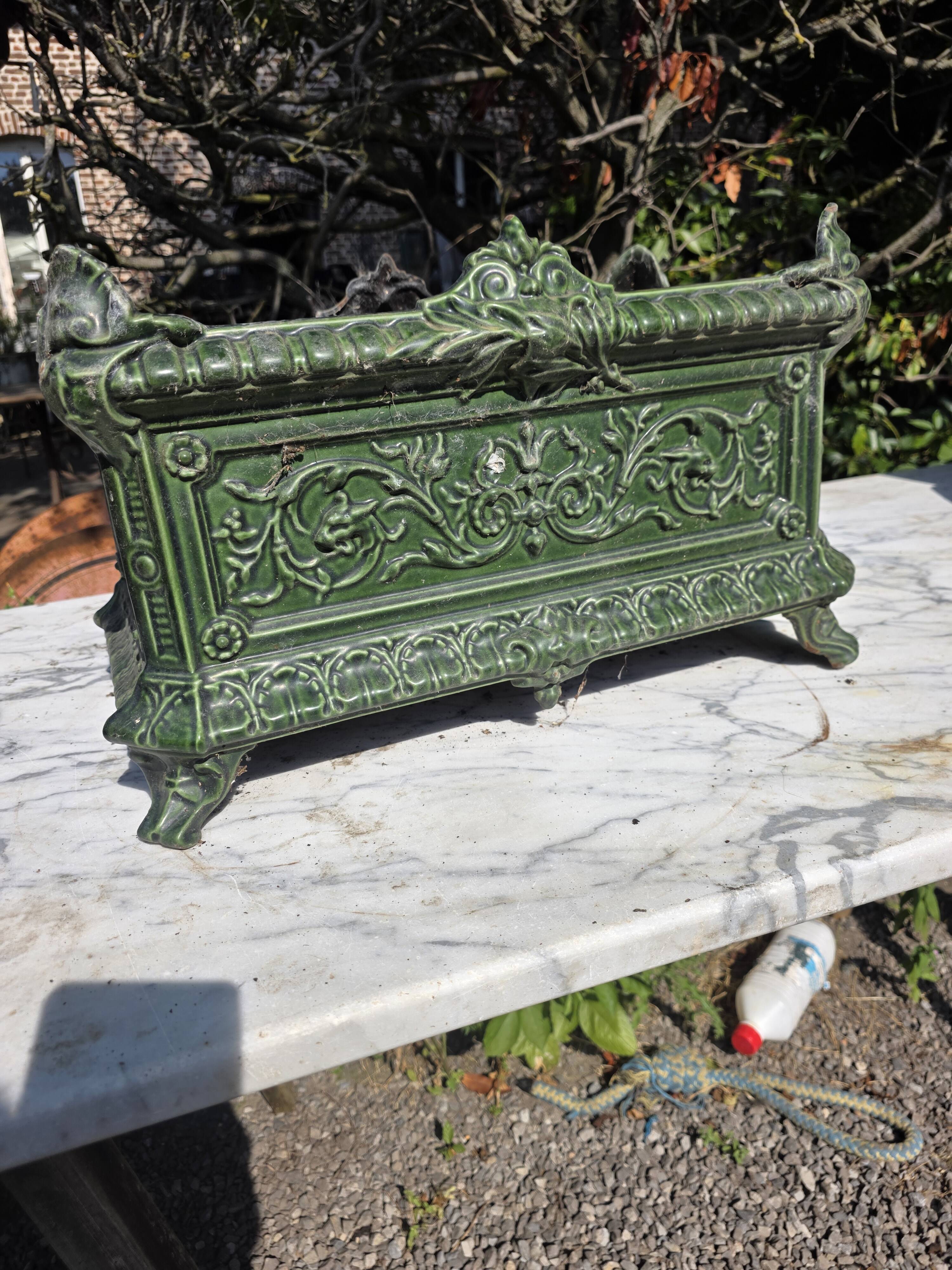 Antique enamelled cast iron planter in the Napoleon III style.