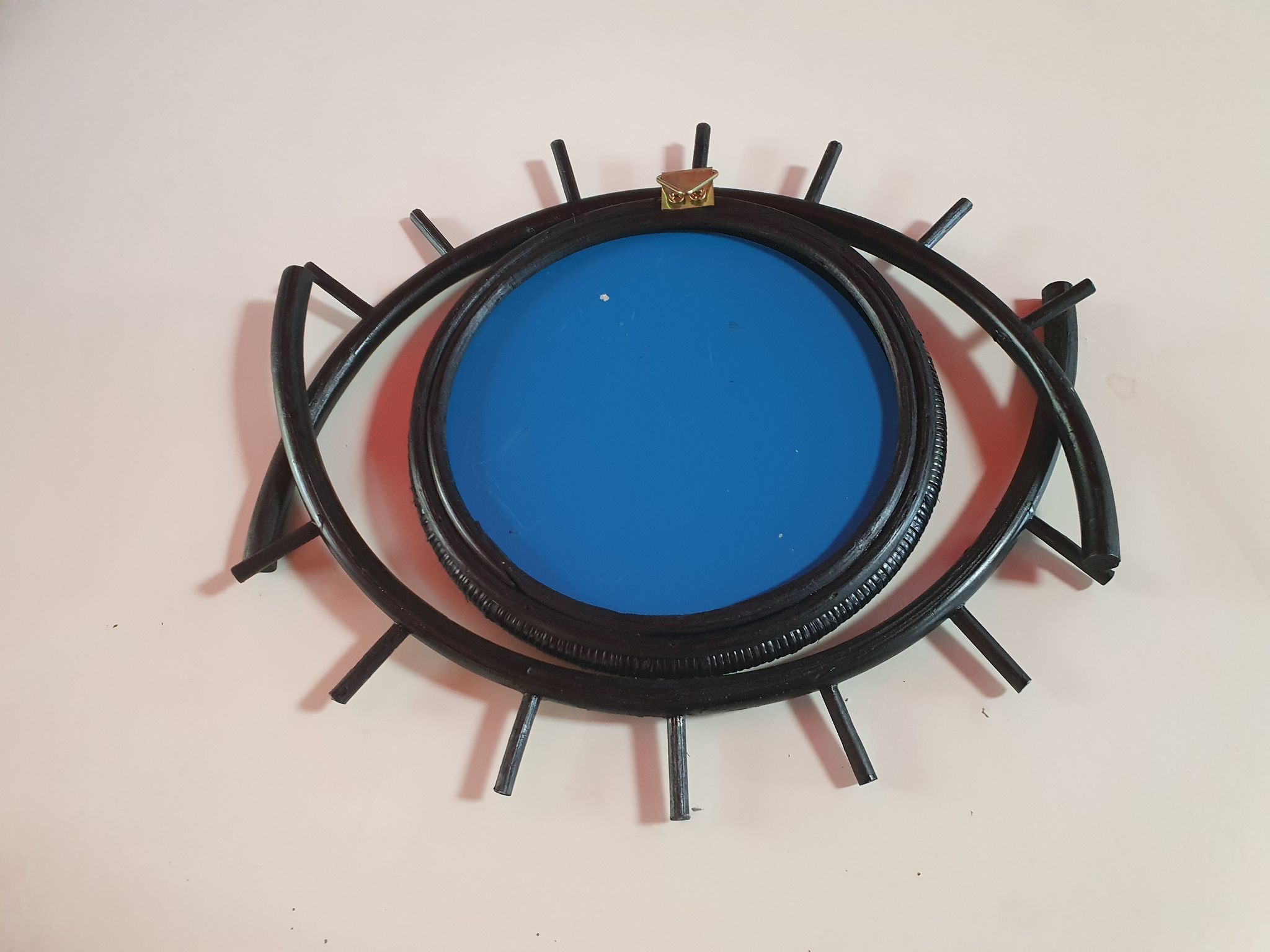 Black rattan mirror in the shape of an eye, 40x35 cm