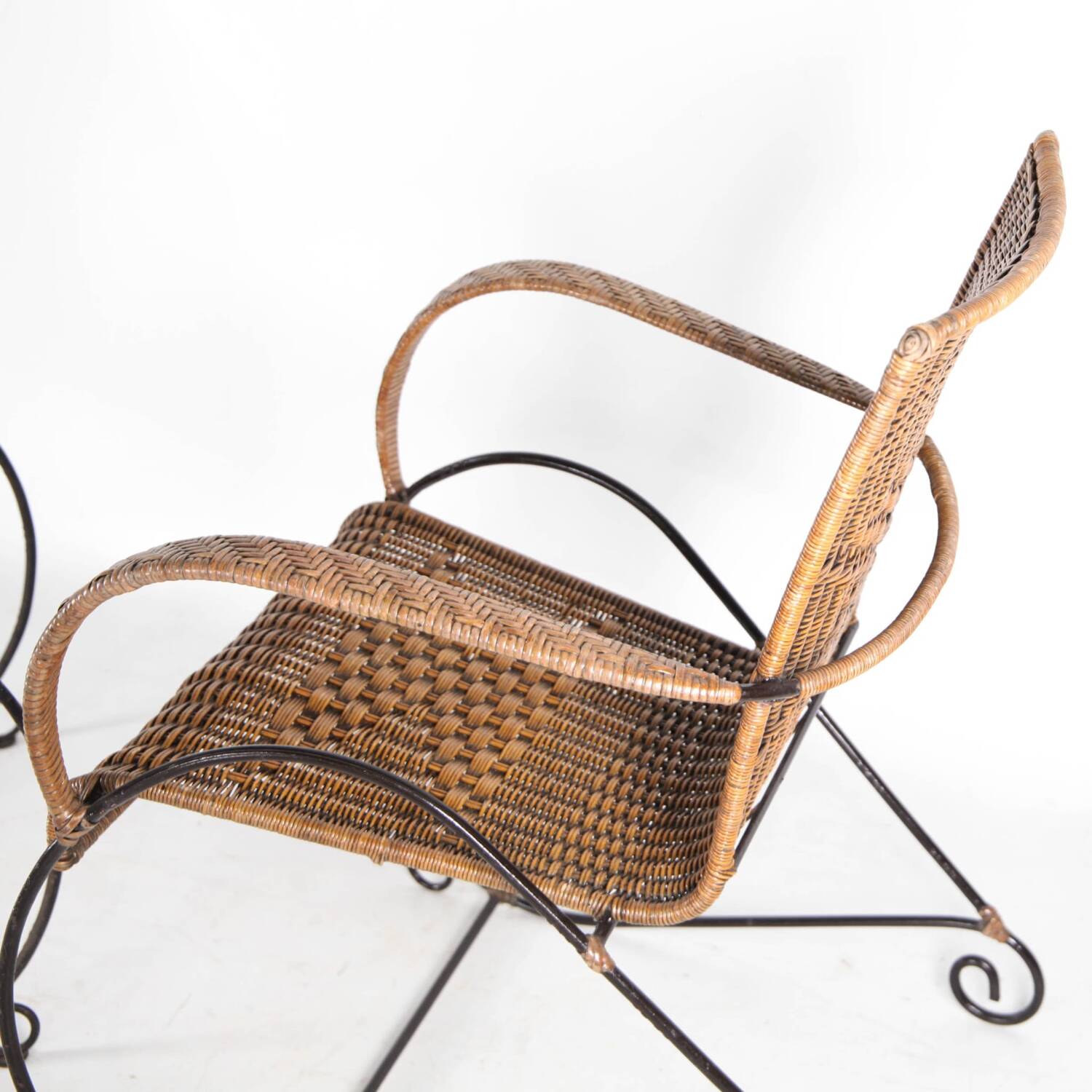 Pair of rattan and iron armchairs