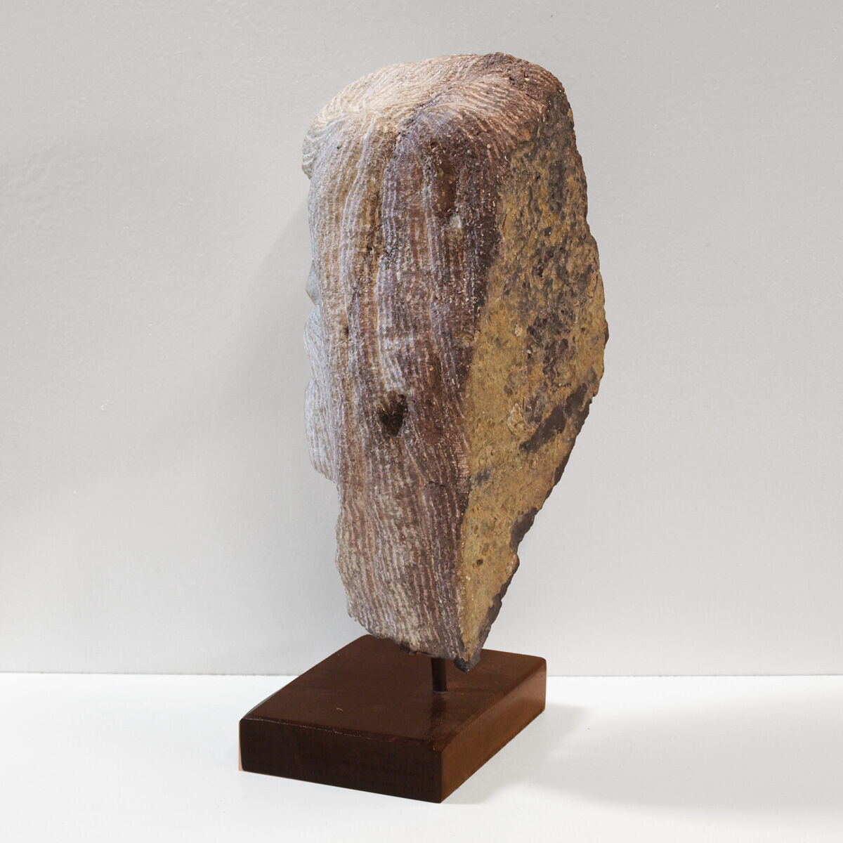 Carved stone head sculpture