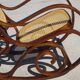 Vintage wooden rocking chair with caning