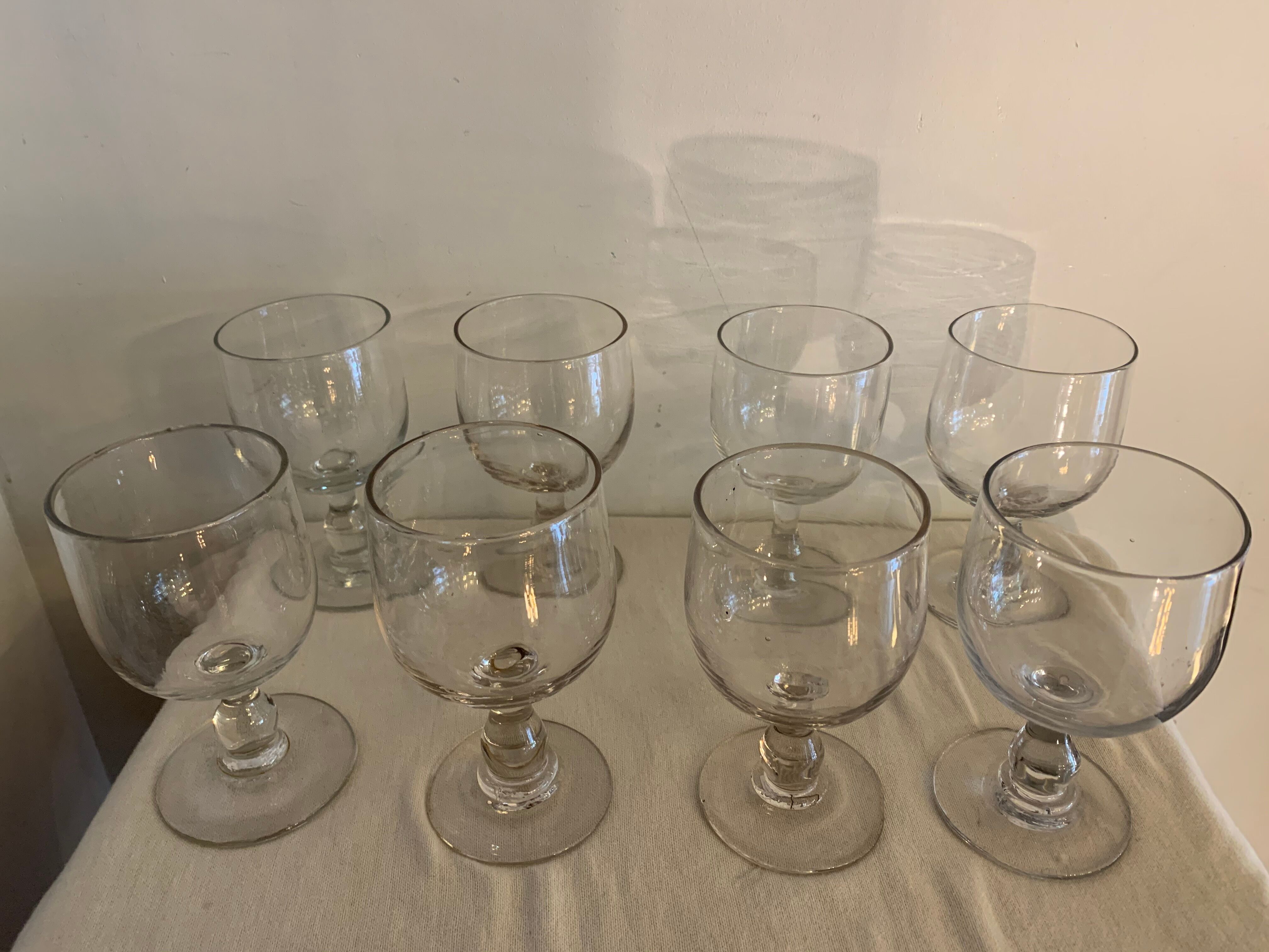 8 old red wine glasses with blown and bubbled glass walk