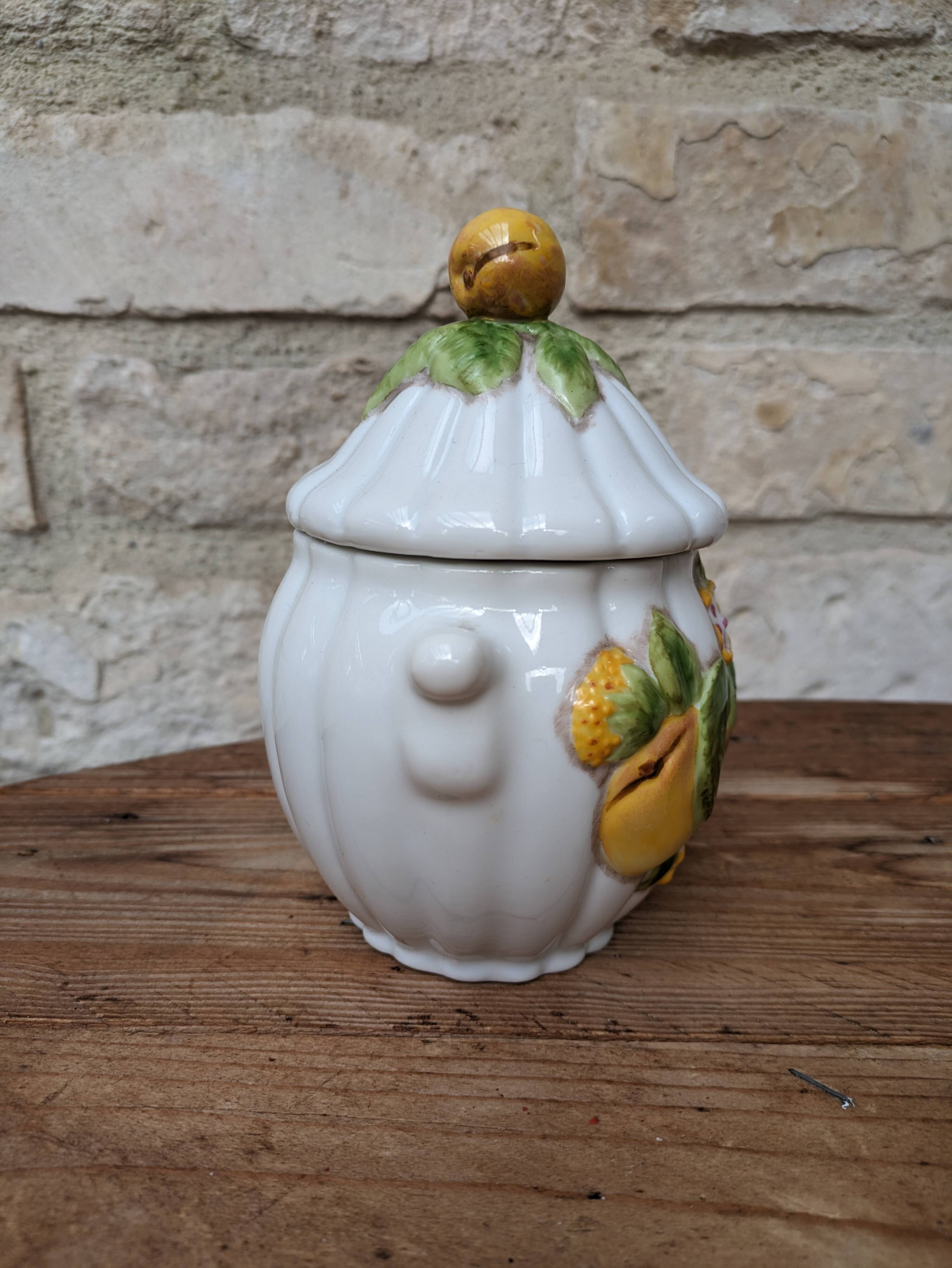 Old ceramic sugar bowl with yellow fruit motif