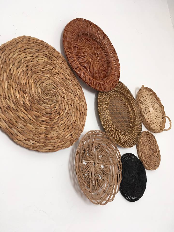 Wall composition of seven baskets and wicker trays