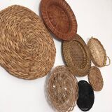 Wall composition of seven baskets and wicker trays