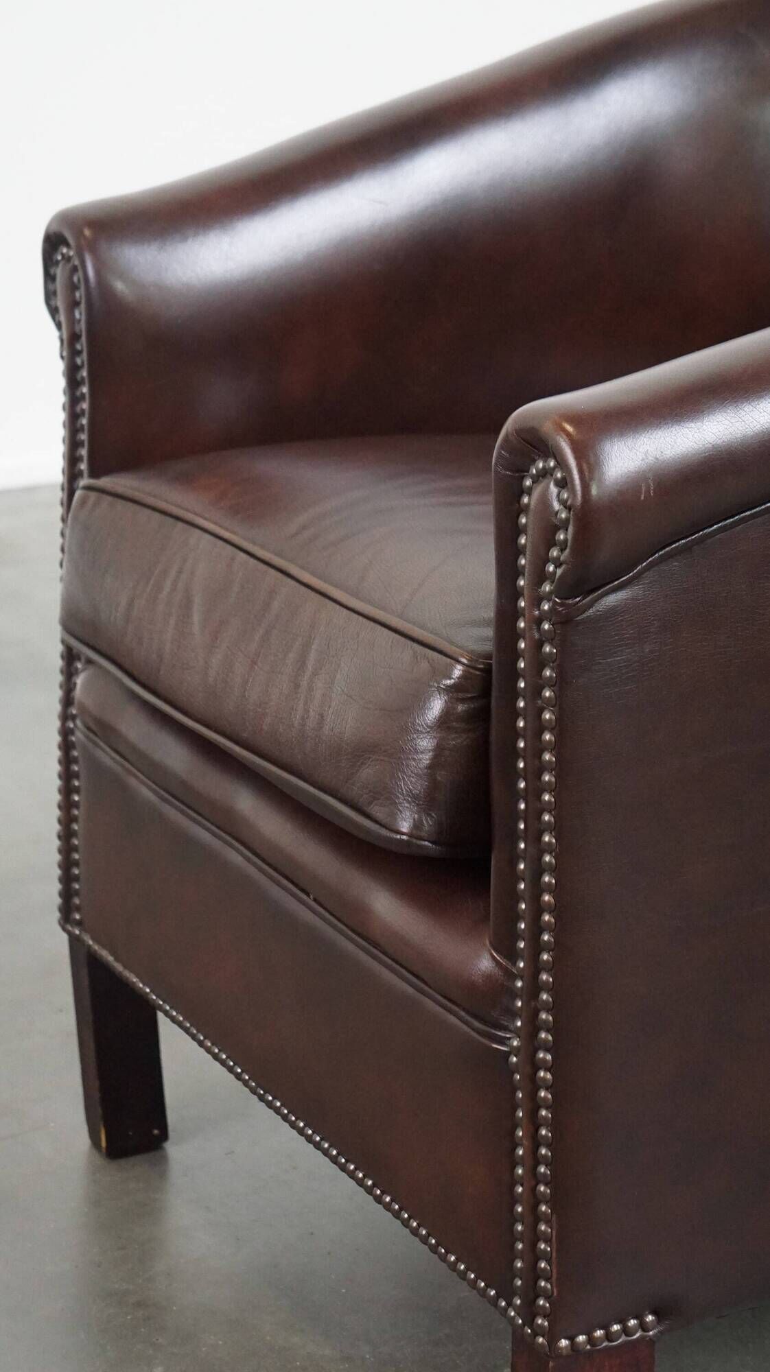 dark cowhide club chair in English style