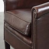 dark cowhide club chair in English style