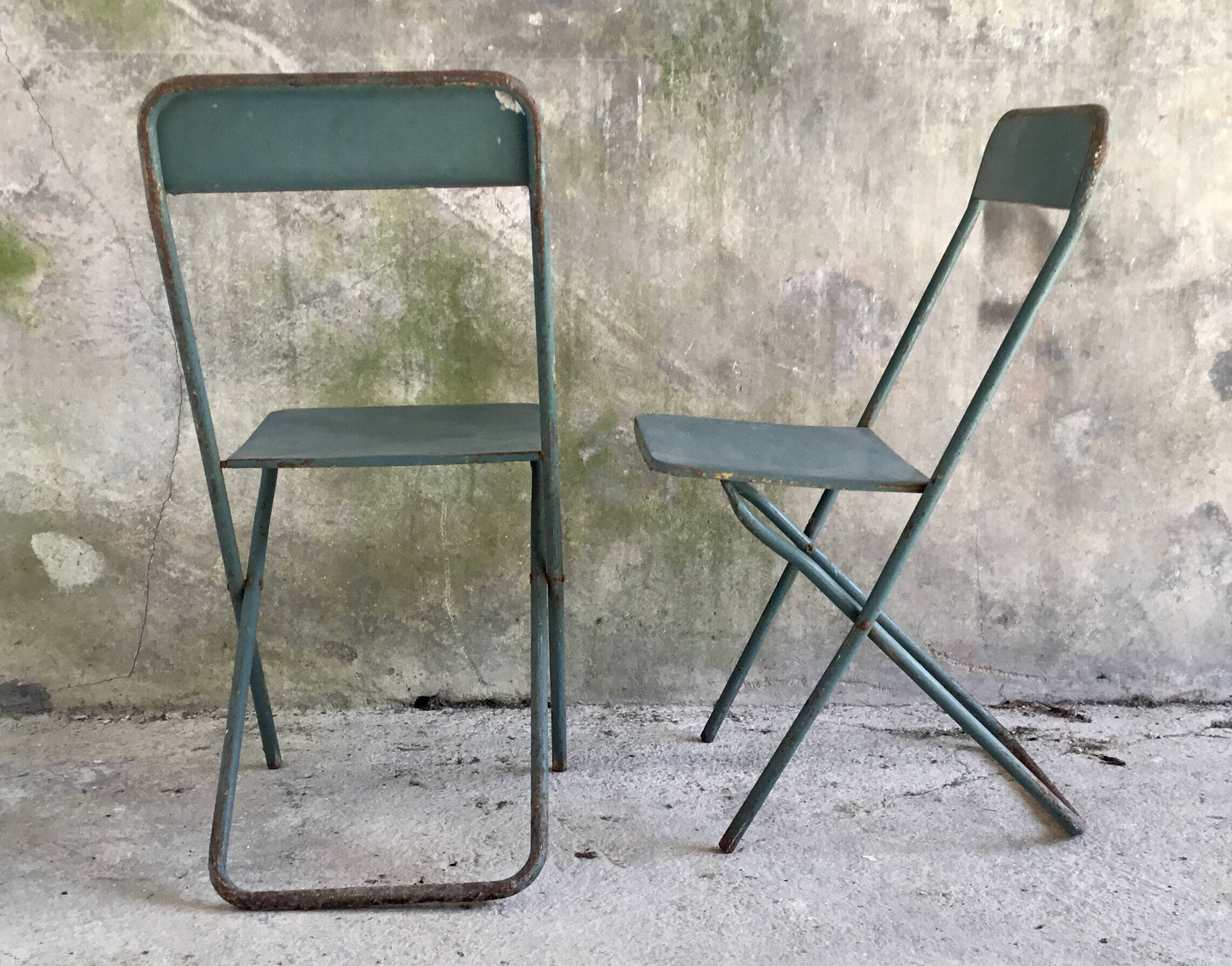 Pair of folding metal chairs, military or industrial, mid-20th century.