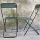Pair of folding metal chairs, military or industrial, mid-20th century.
