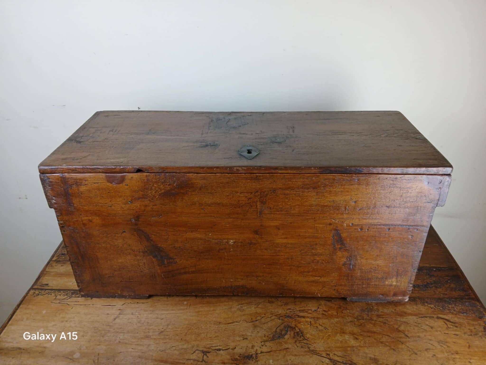 Old solid wood transport chest from the early 19th century