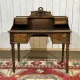 Louis XVI style desk from the late 19th century in walnut with a leather top.