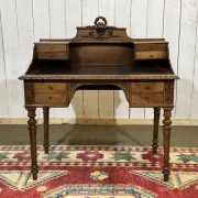 Louis XVI style desk from the late 19th century in walnut with a leather top.