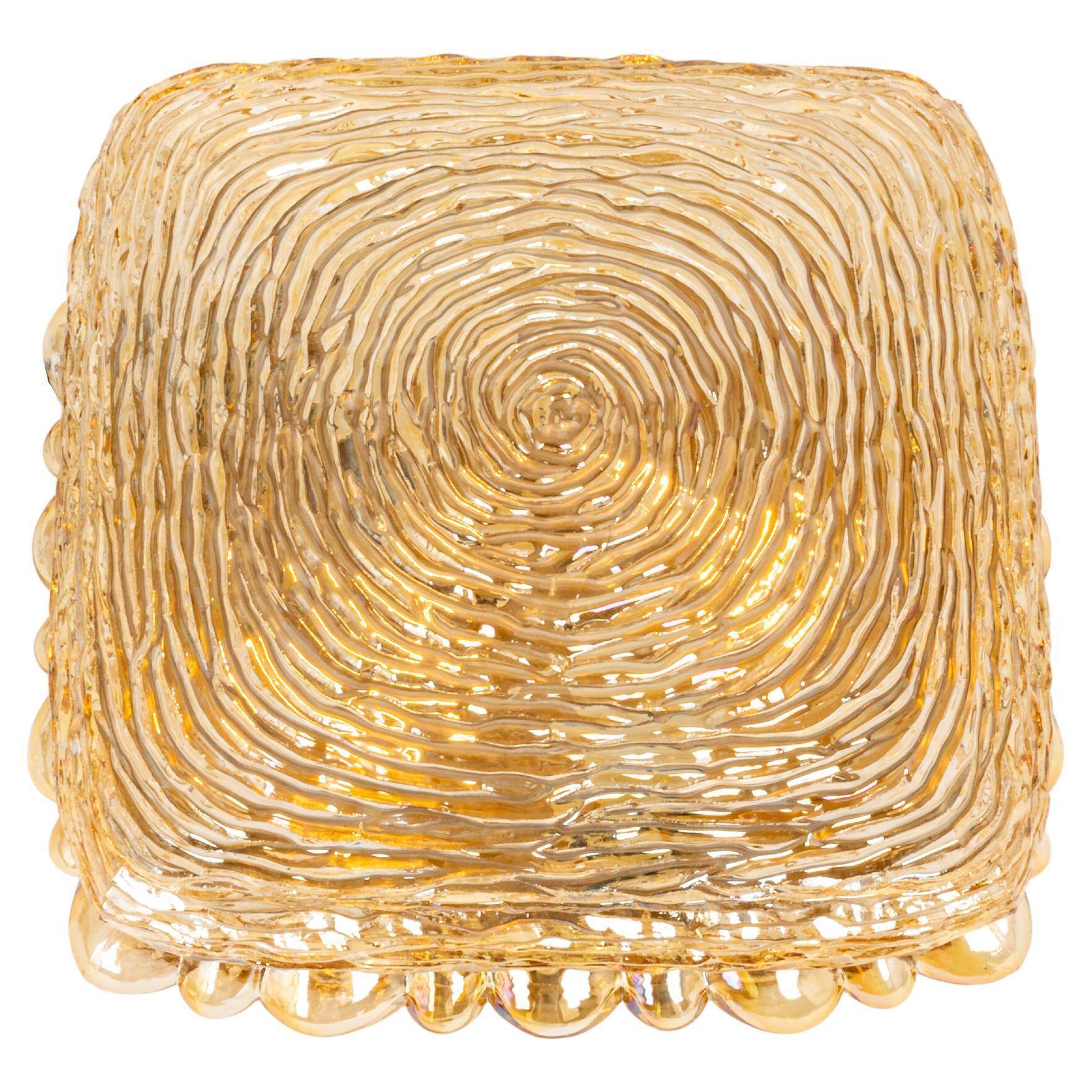 Amber glass wall light in the shape of a fingerprint, Germany, 1970s.