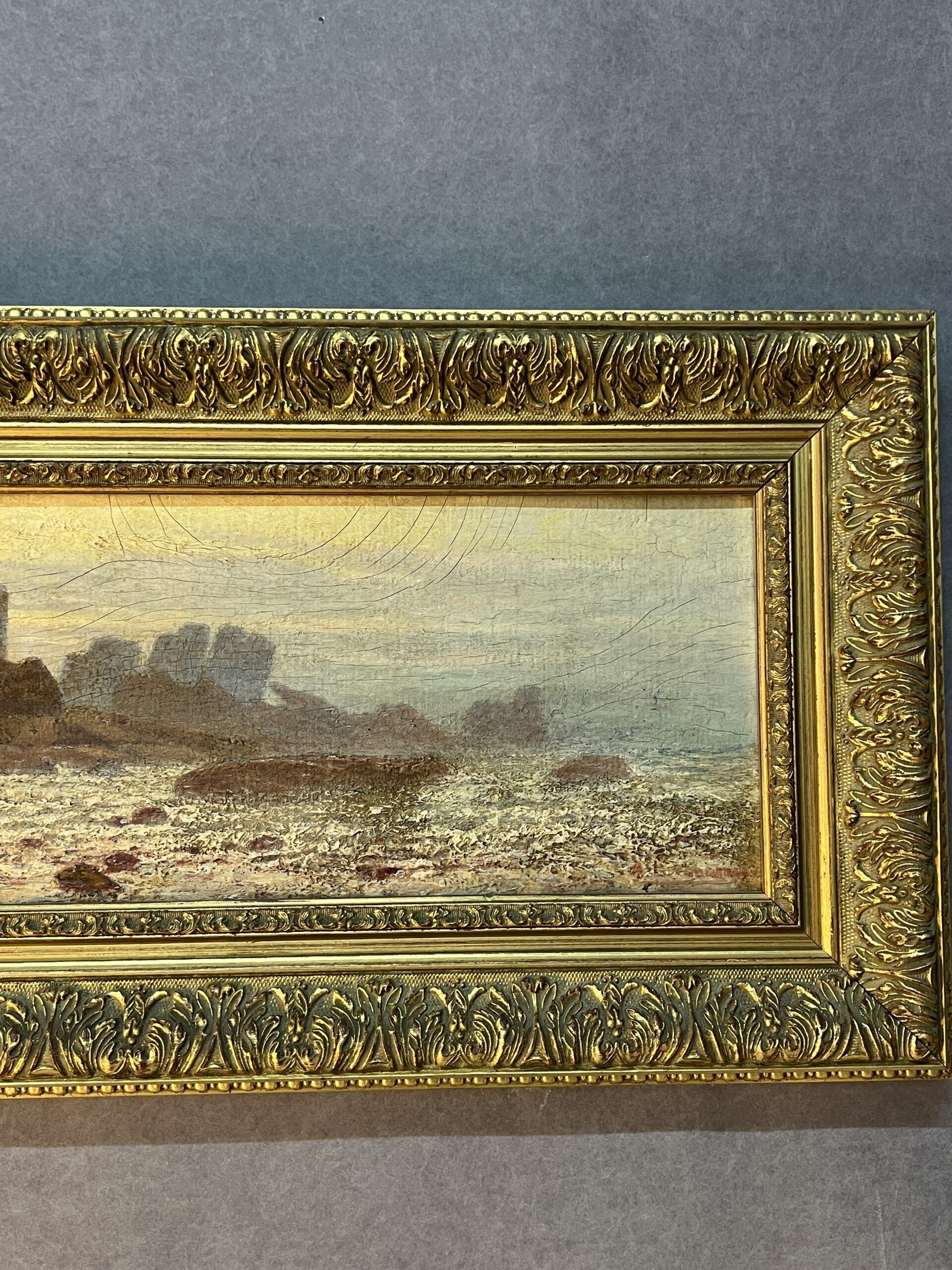 A. Laemmermann, oil painting on cardboard depicting a rocky landscape.