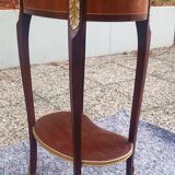 Louis XVI period pedestal table, in solid mahogany and veneer, and in gilded bronze.