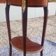 Louis XVI period pedestal table, in solid mahogany and veneer, and in gilded bronze.