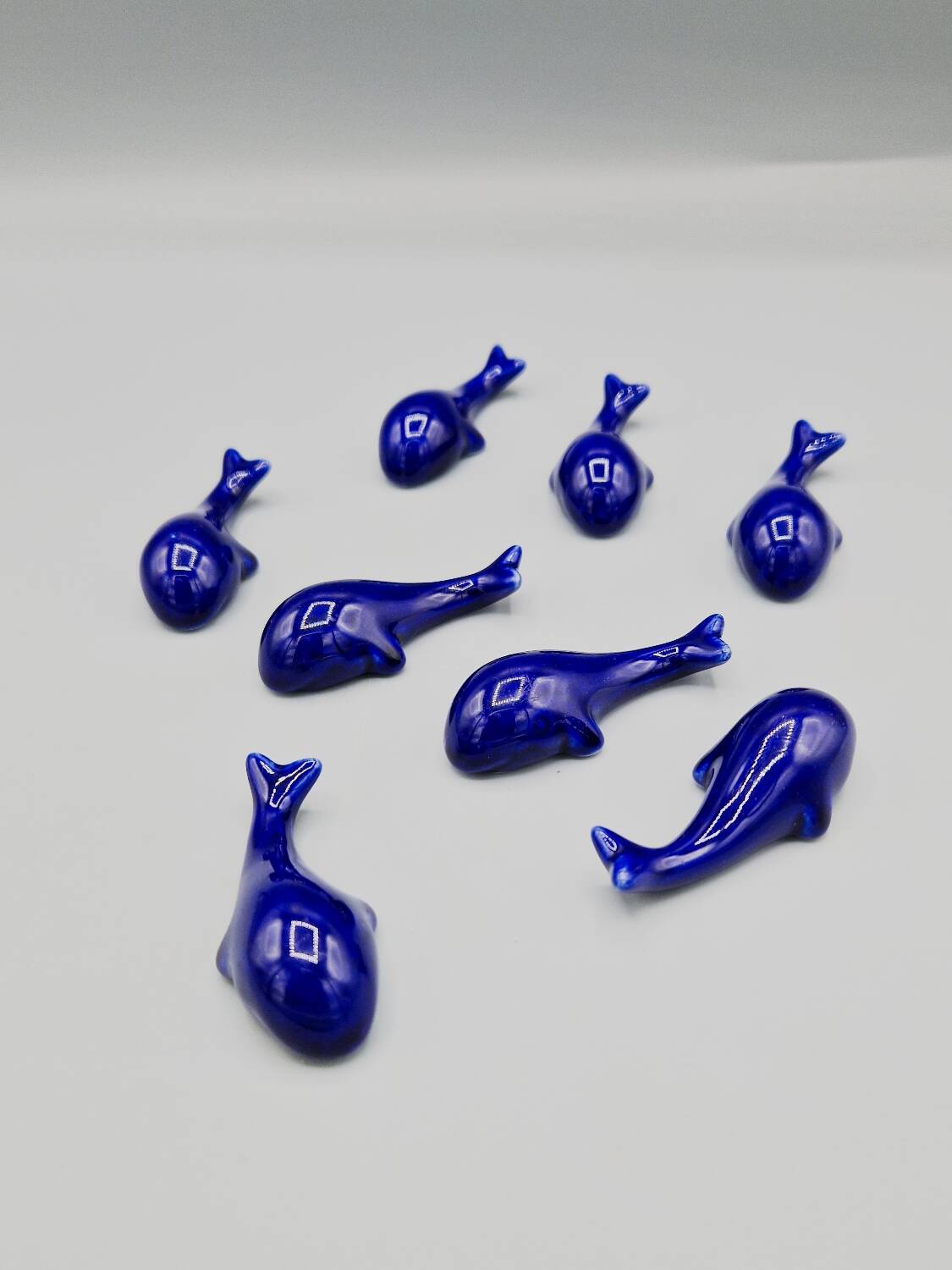 Set of 6 vintage blue porcelain whale knife rests.