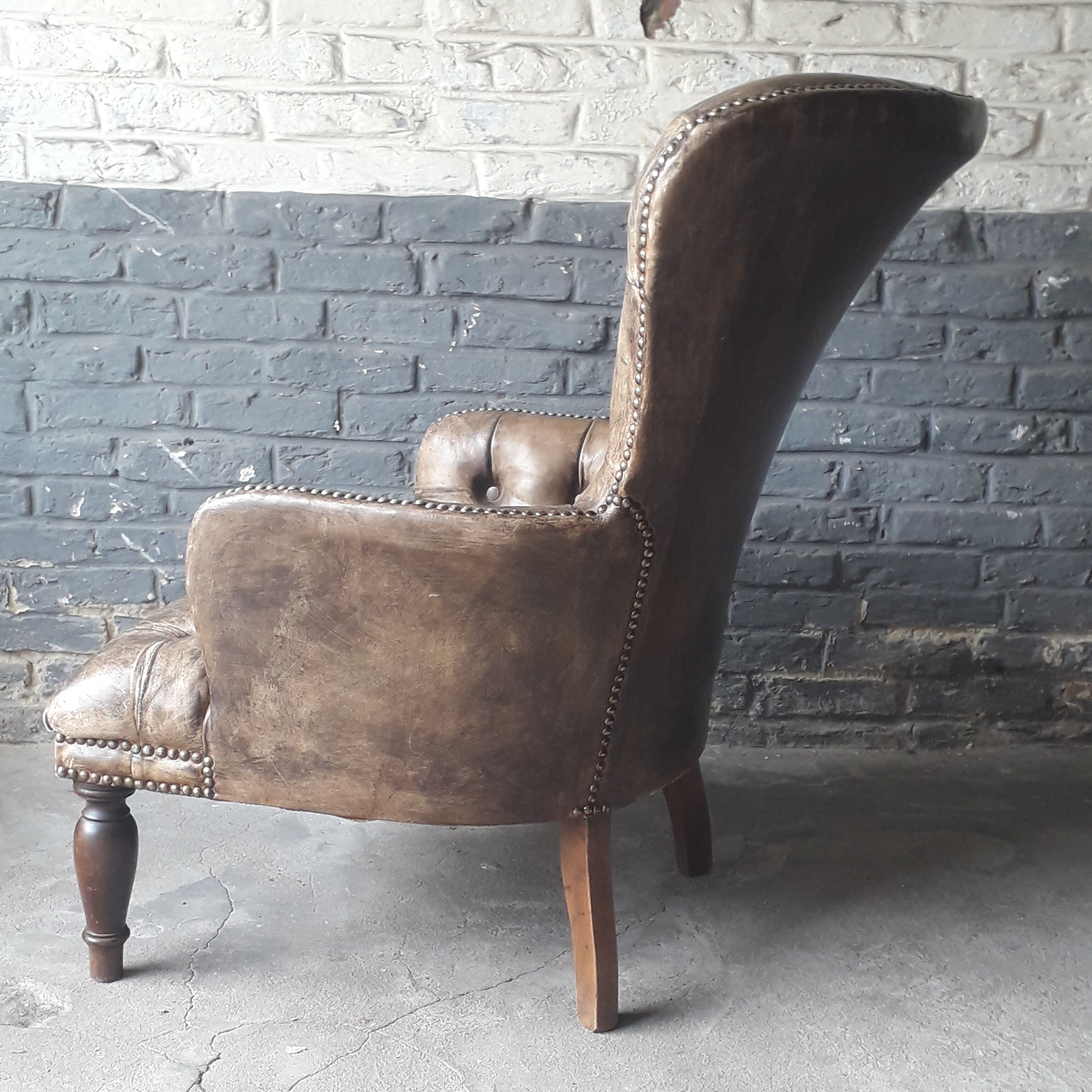 Fauteuil Chesterfield antique