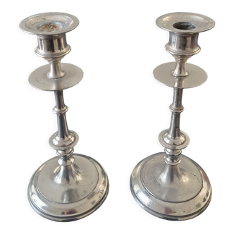 Pair of candle holders in silver metal
