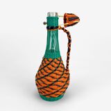 High glass bottle and braided scoubidous threads
