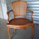 Pair of caned cabriolet armchairs