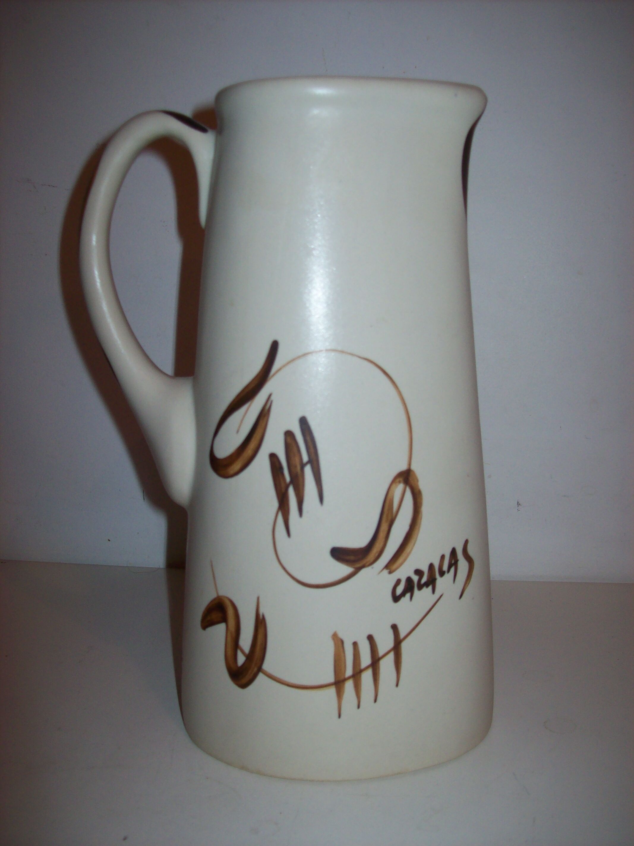 Ceramic pitcher with hand-painted decoration