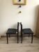 Pair of Danish chairs from the 60s in teak and black leatherette.