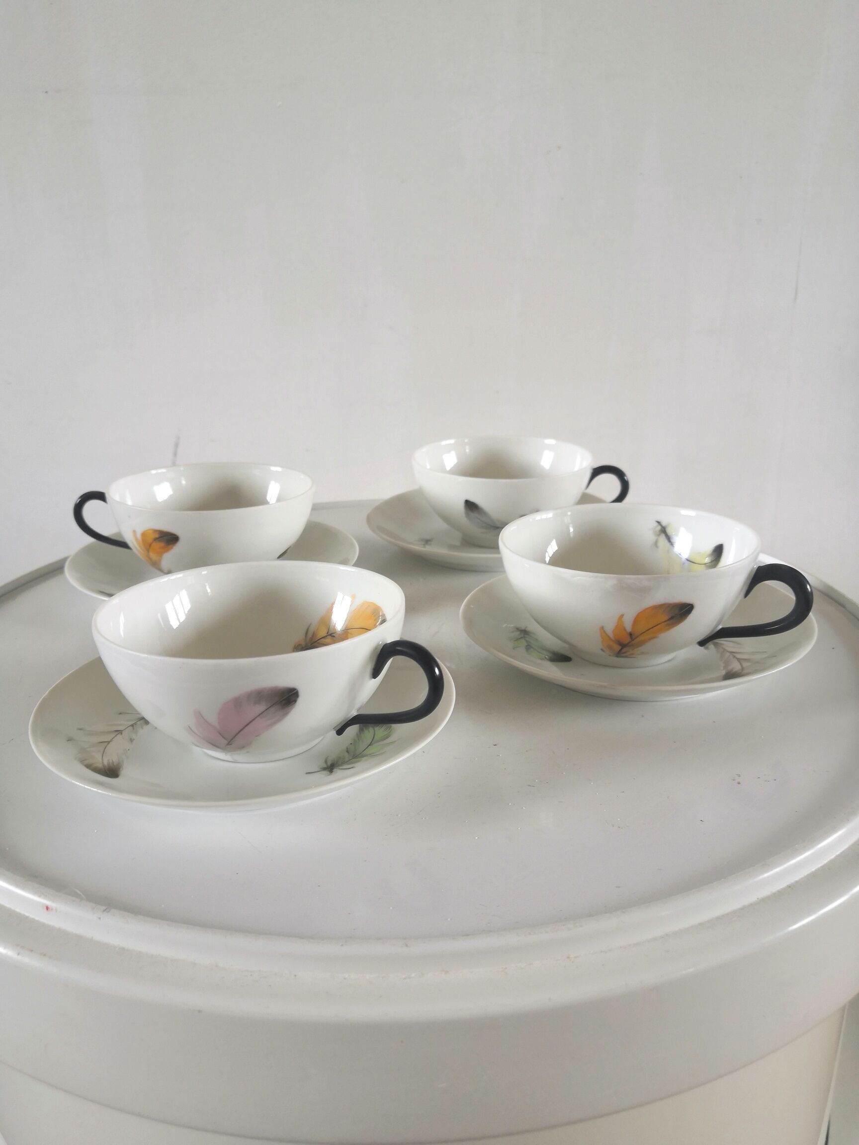 4 cups and cups in fine Limoges porcelain signed LC 60s