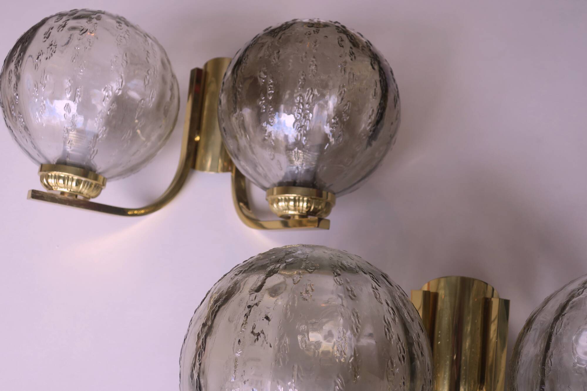Mid century pair of brass and glass double wall lights, 1970s
