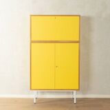 Classic sideboard from the 1960s, oak veneer, yellow Resopal, white steel feet