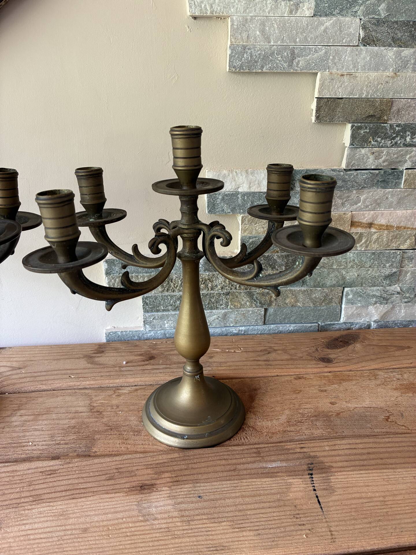 Pair of large 5-light candlesticks in patinated brass, classical style.
