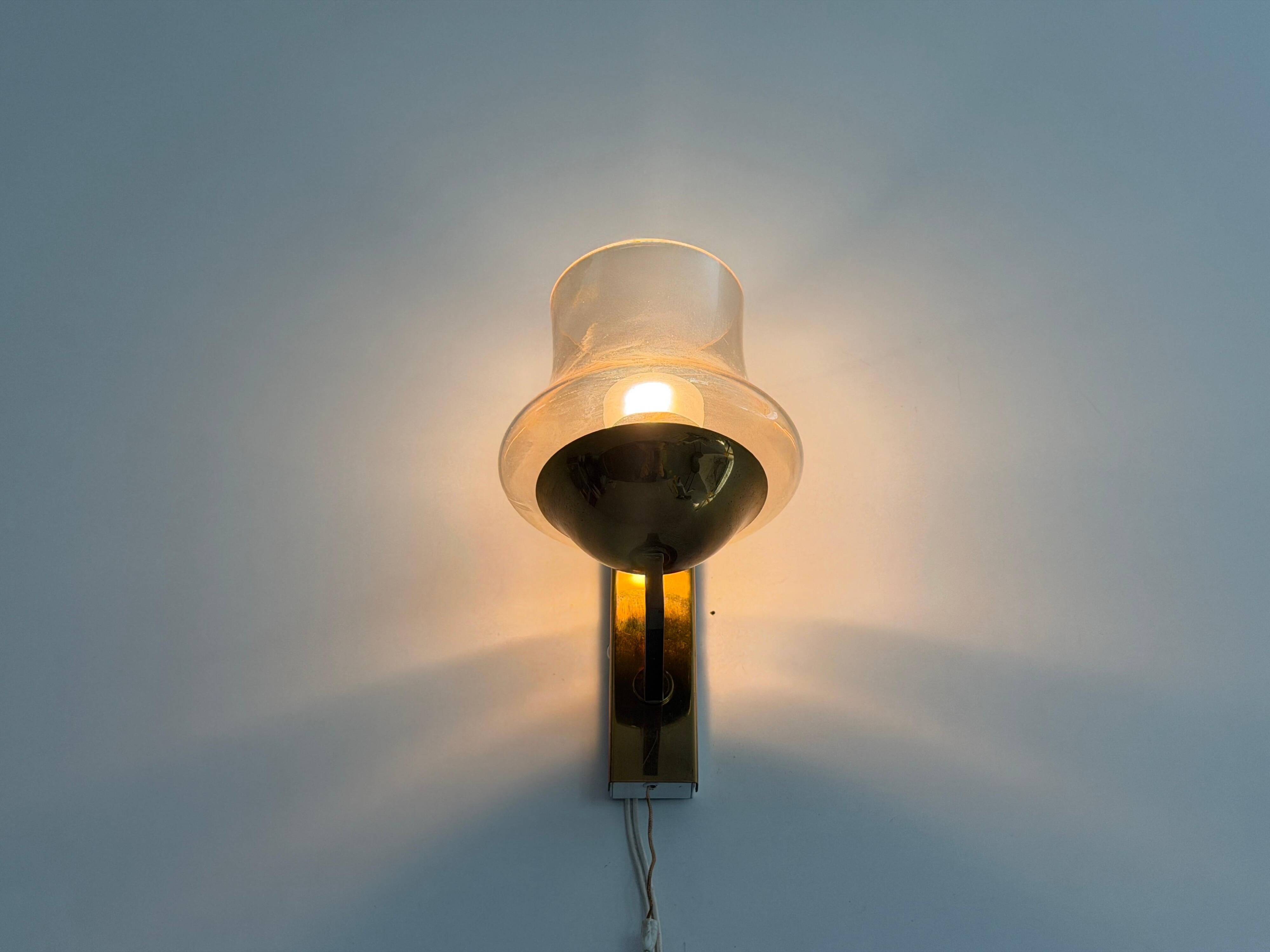 Yellow glass and brass wall light from the mid-century, 1960, Germany.