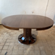 Round, extendable dining table