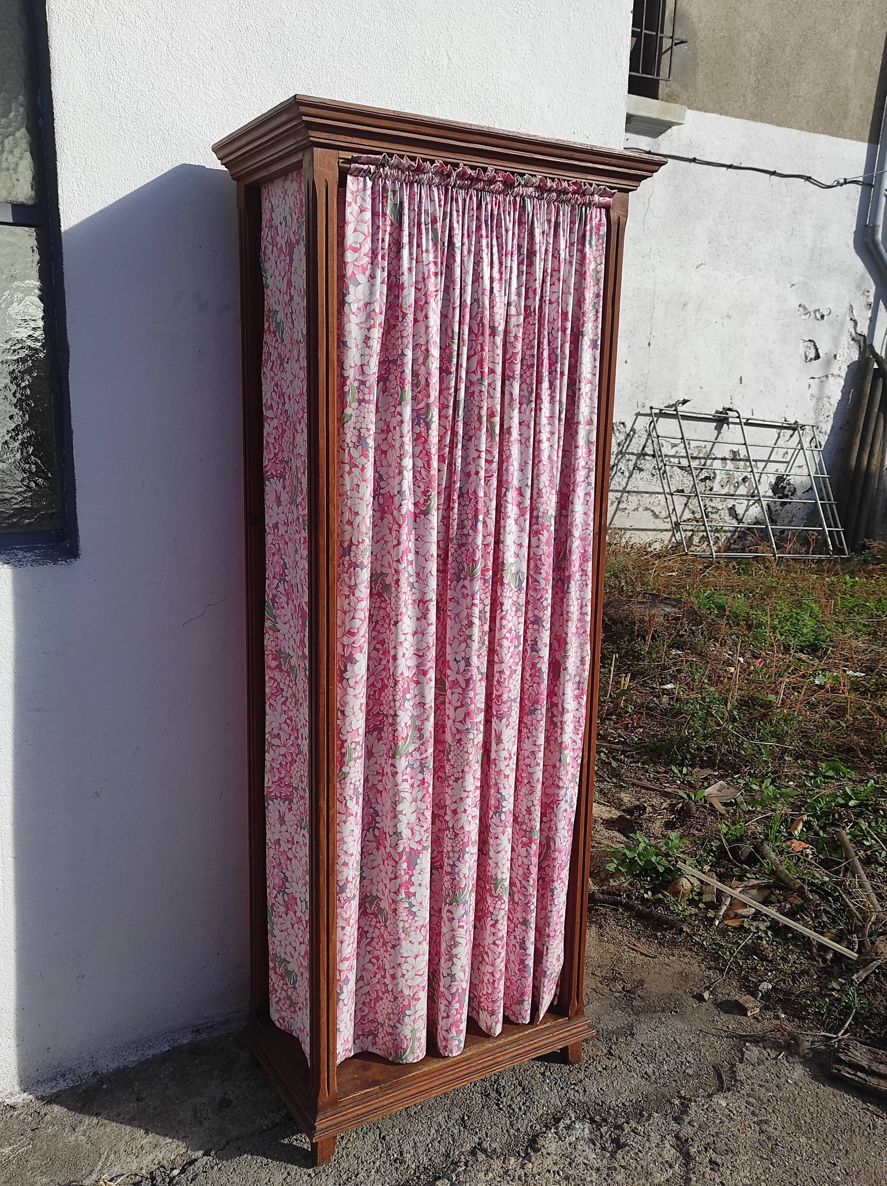Old wardrobe in old wood and vintage fabric