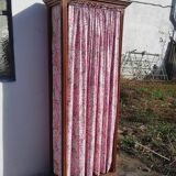 Old wardrobe in old wood and vintage fabric