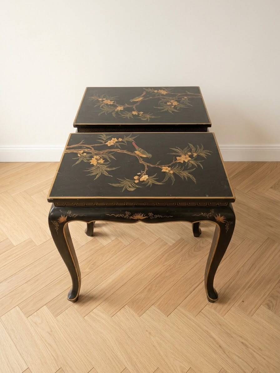Set of 2 Chinese low tables in black lacquered wood with gold decoration.