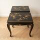 Set of 2 Chinese low tables in black lacquered wood with gold decoration.