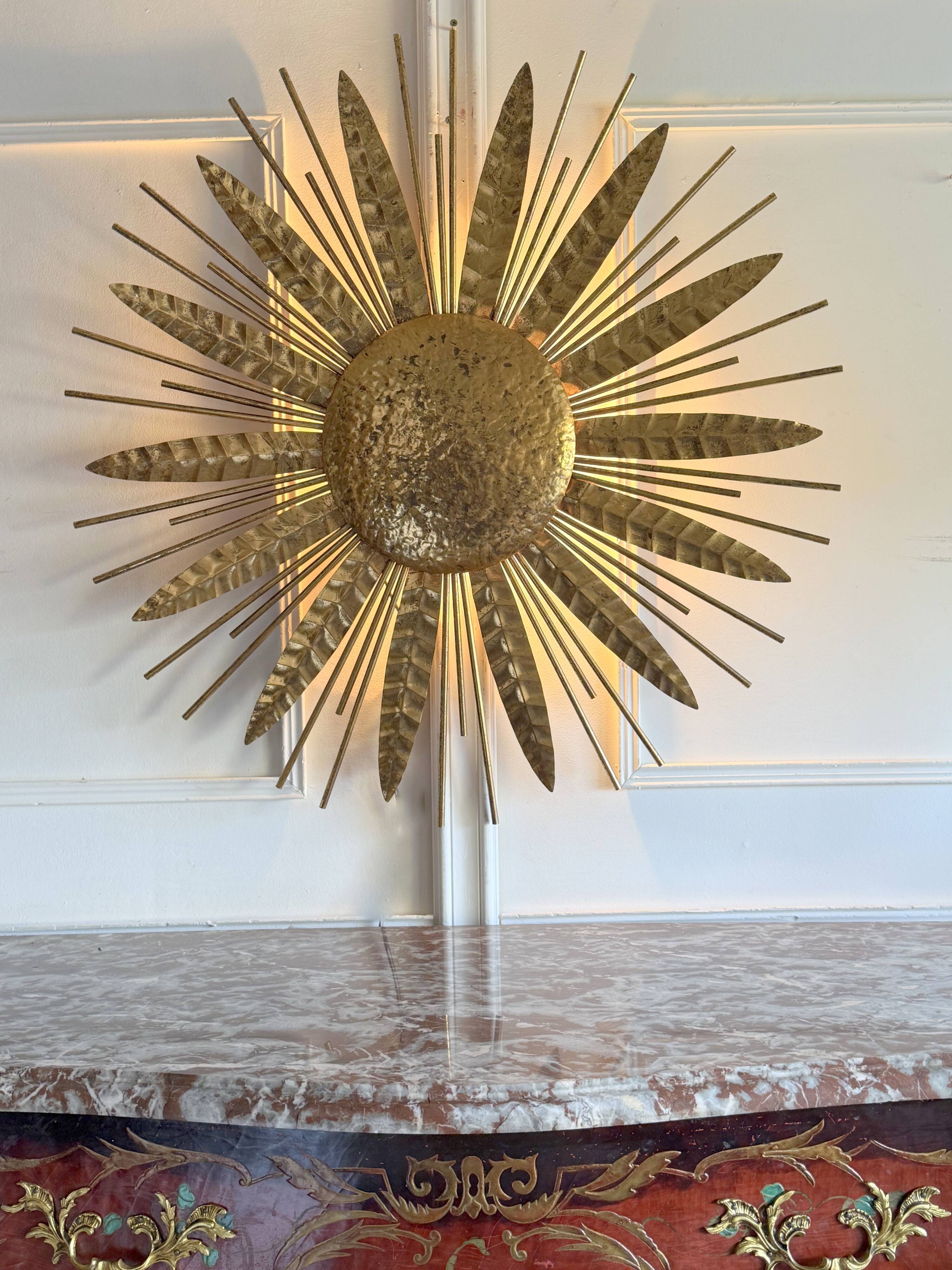 Large golden hammered metal sun wall light with a diameter of 90 cm from the year